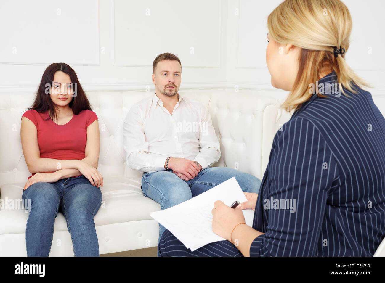 Young couple at a reception with a psychologist. Stock Photo