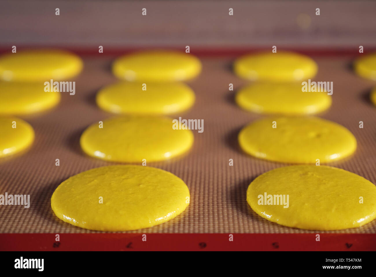 Cooking Macaroons On Stencil Silicone Mat On The Table Close Up