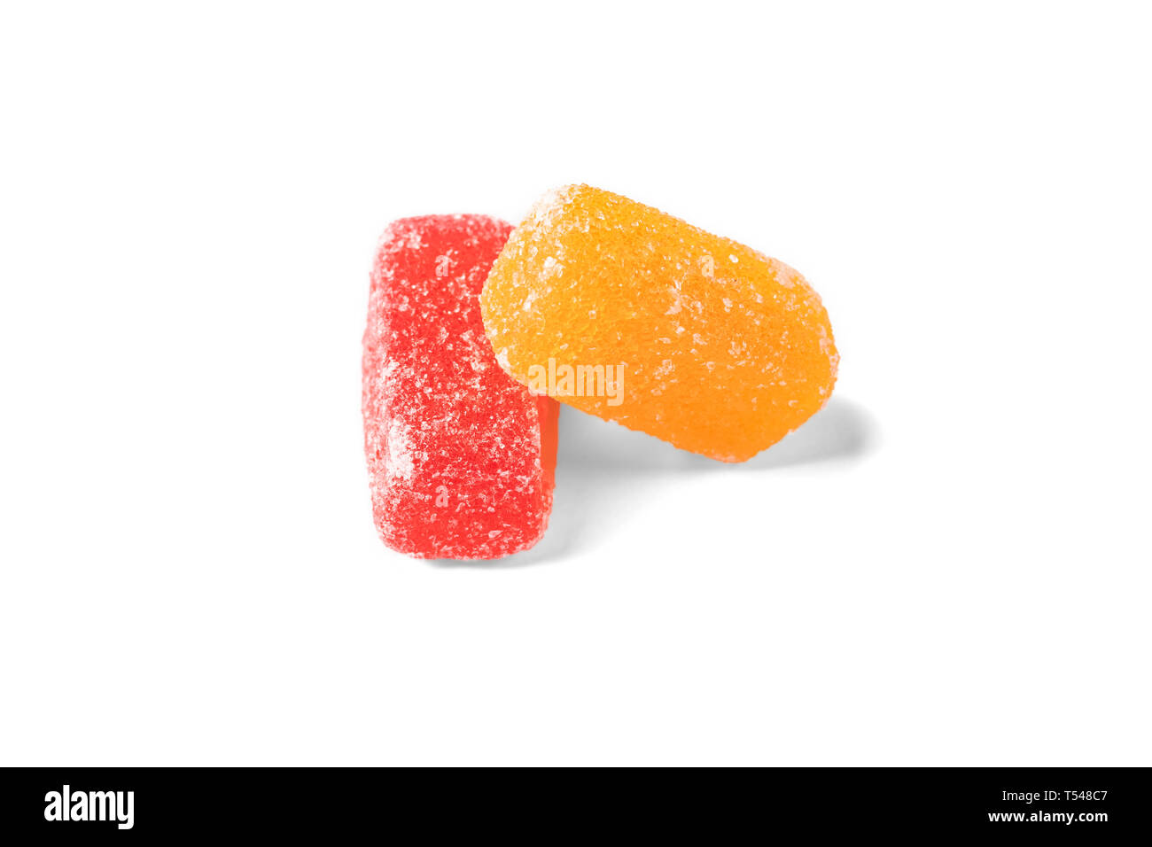 Two marmalade sweets. Yellow lies on red. Isolate on white background
