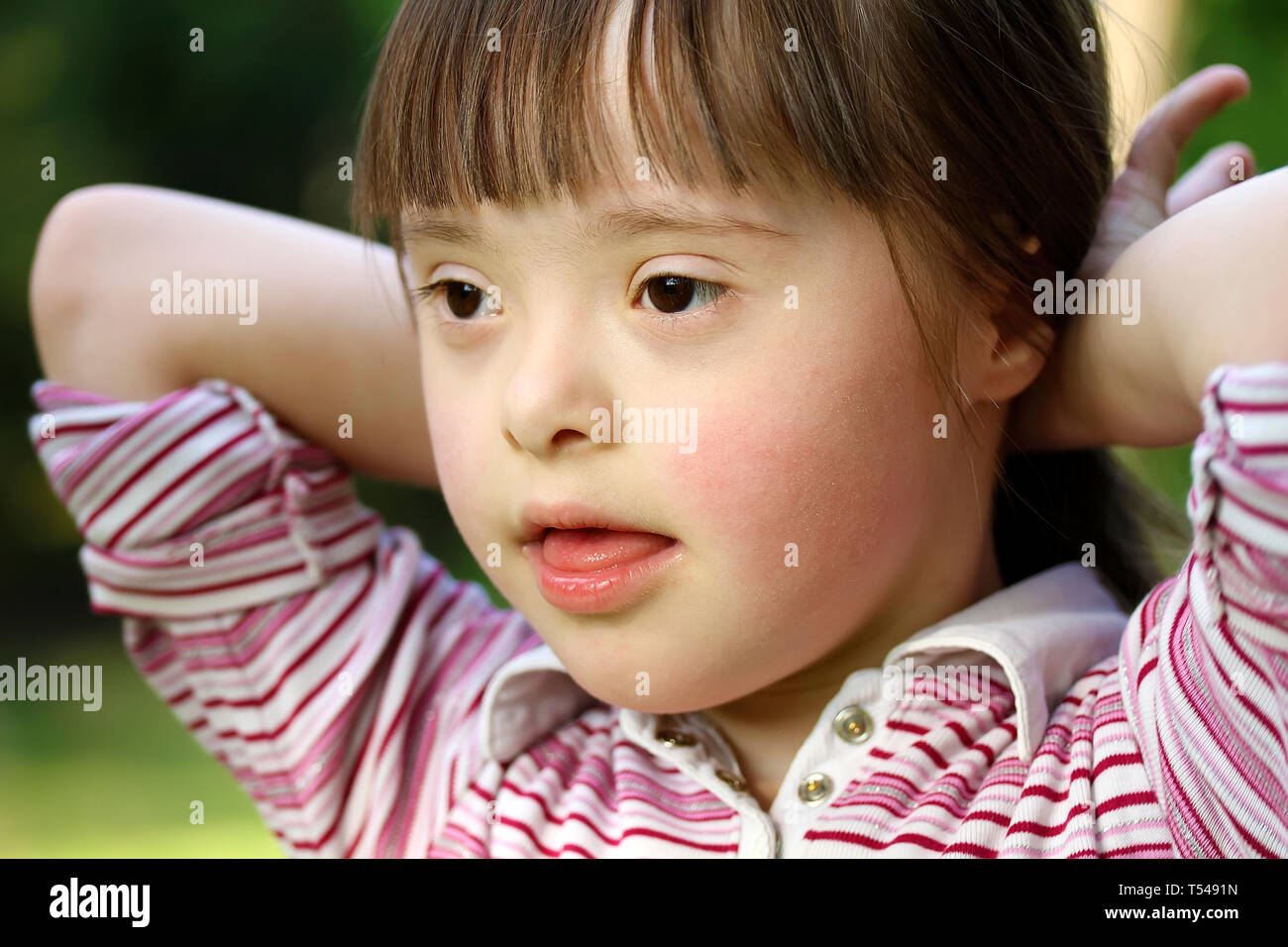 Portrait of little girl outside Stock Photo - Alamy
