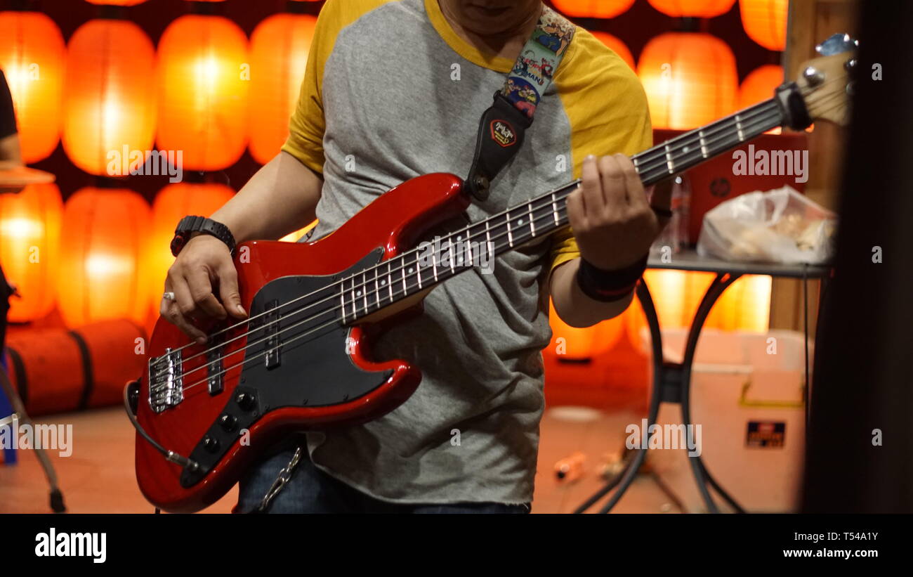 Bass guitar player Stock Photo - Alamy