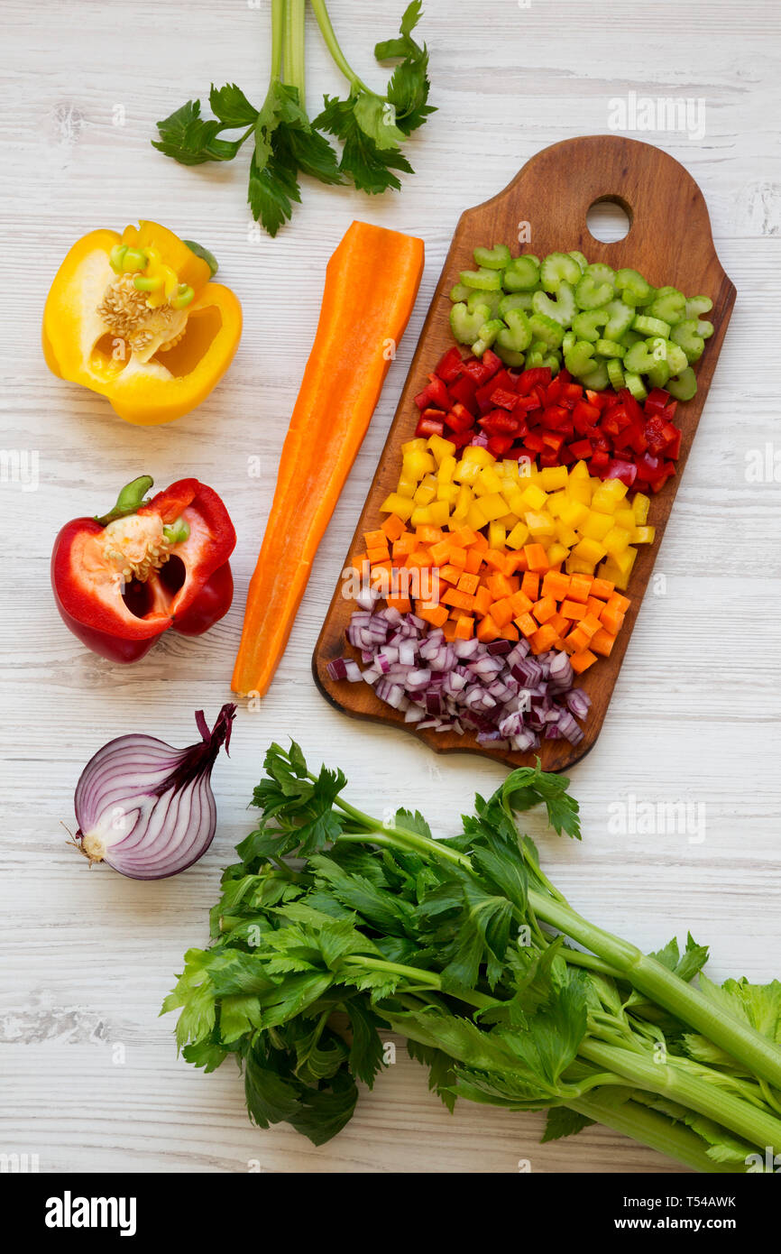 Chopped fresh fruits arranged on cutting board on white wooden surface, top  view. Ingredients for fruit salad. From above, flat lay, overhead Stock  Photo - Alamy