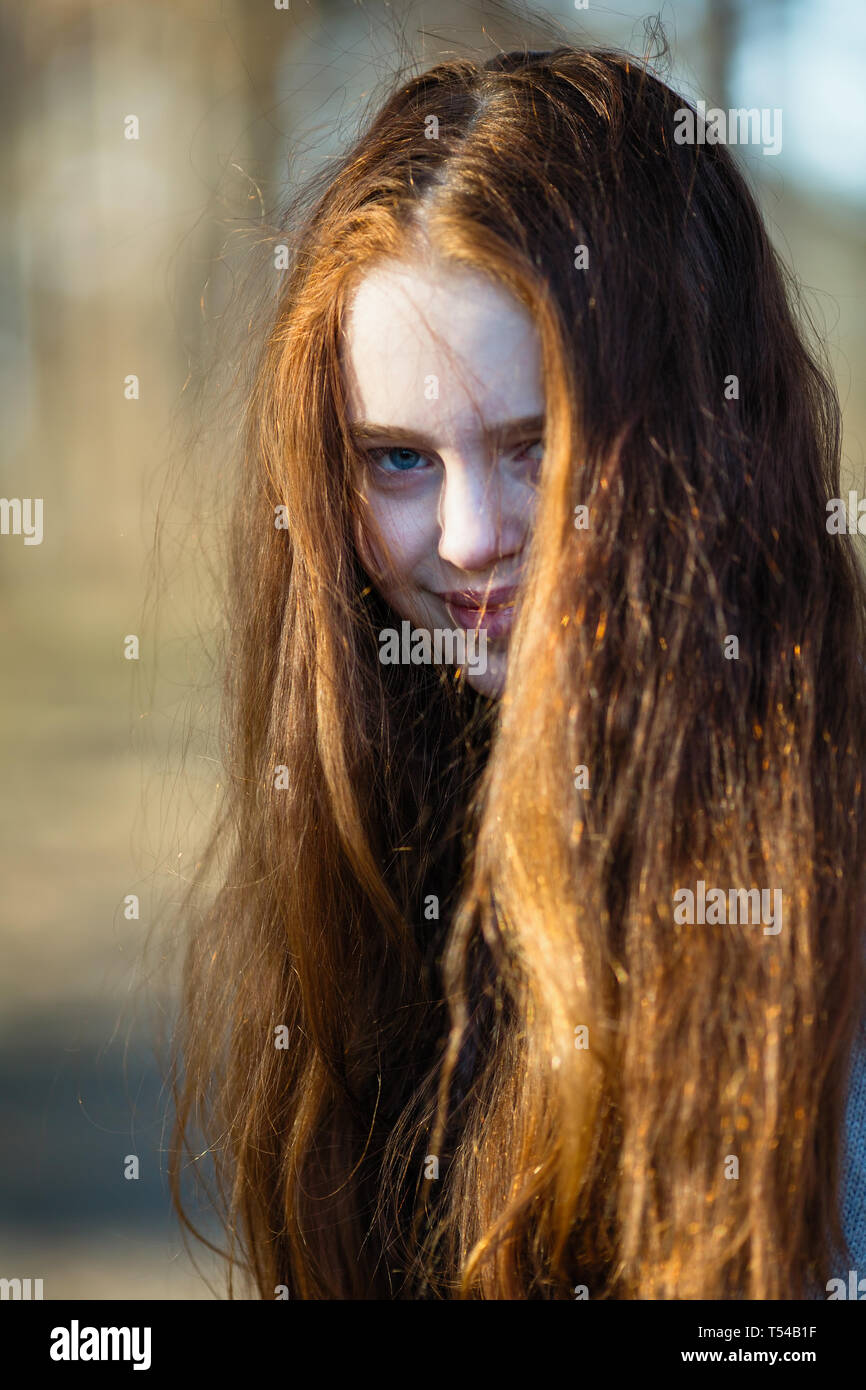 Portrait of pretty young girl with long bright red hair Stock Photo - Alamy