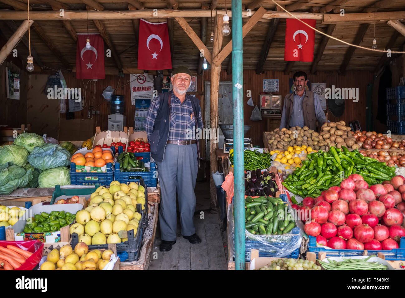 Konya, Turkey - October 21, 2018: Unidentified turkish salesman selling fruit and vegetables in his shop in Konya city Stock Photo