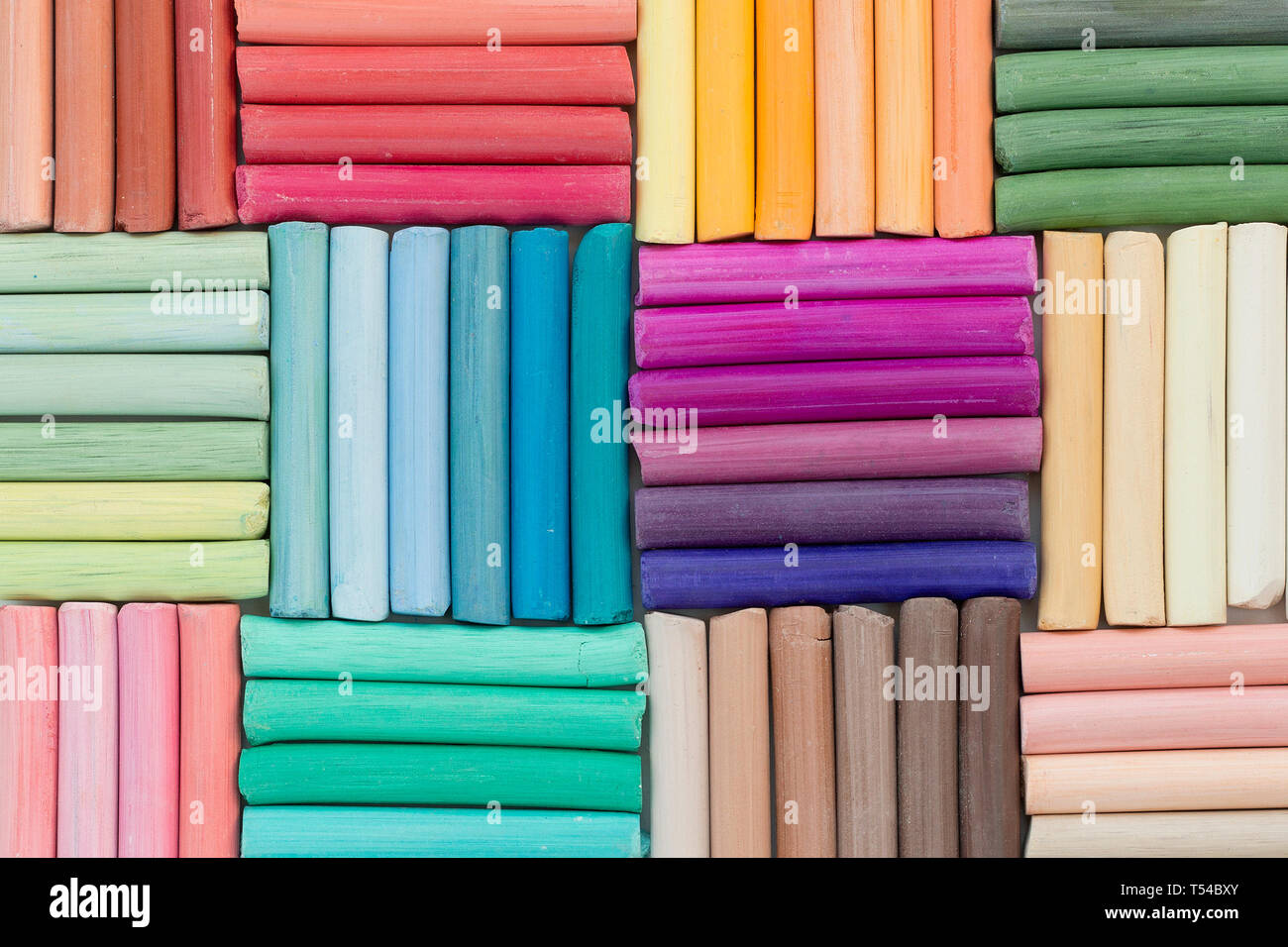 Bright background of rainbow pastel crayons. Vivid pattern. Back to school concept Stock Photo