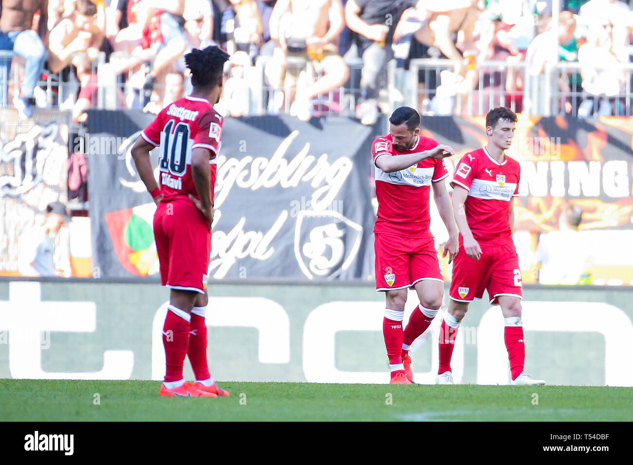 Augsburg, Germany. 20th Apr, 2019. Soccer: Bundesliga, FC Augsburg - VfB Stuttgart 30th matchday in the WWK-Arena. from left: Daniel Didavi (VfB Stuttgart), Gonzalo Castro (VfB Stuttgart) and Benjamin Pavard (VfB Stuttgart) dissatisfied. Credit: Tom Weller/dpa - IMPORTANT NOTE: In accordance with the requirements of the DFL Deutsche Fußball Liga or the DFB Deutscher Fußball-Bund, it is prohibited to use or have used photographs taken in the stadium and/or the match in the form of sequence images and/or video-like photo sequences./dpa/Alamy Live News Stock Photo