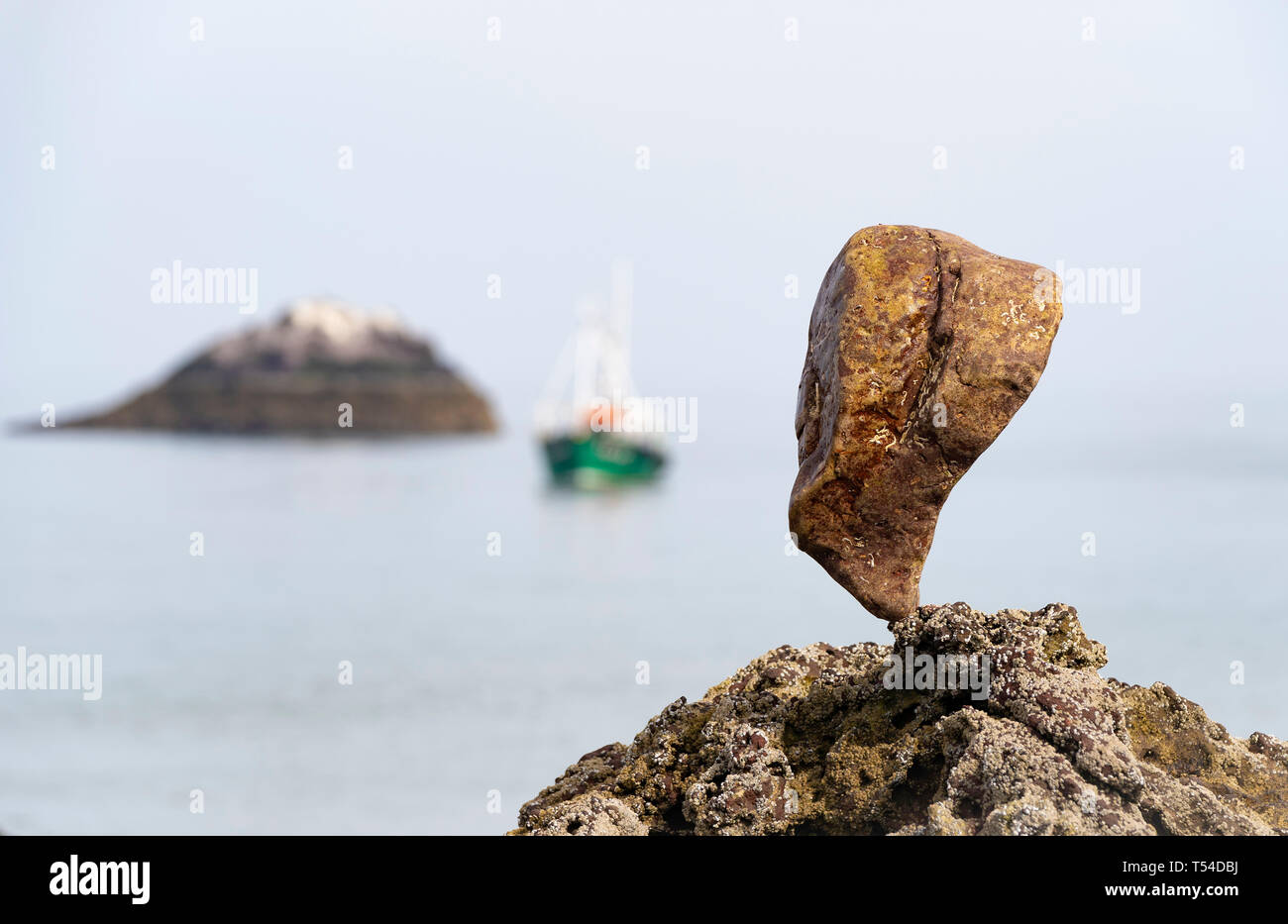 Dunbar, Scotland, UK. 20th Apr, 2019. Solitary stone balanced on rock at Eye Cave beach in Dunbar during opening day of the European Stone Stacking Championship 2019. Credit: Iain Masterton/Alamy Live News Stock Photo