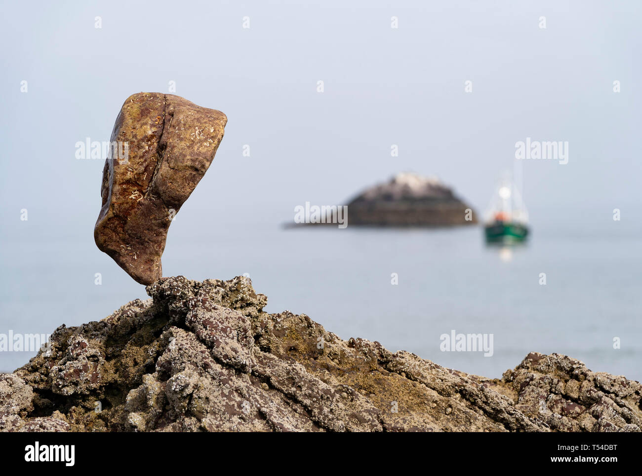 Dunbar, Scotland, UK. 20th Apr, 2019. Solitary stone balanced on rock at Eye Cave beach in Dunbar during opening day of the European Stone Stacking Championship 2019. Credit: Iain Masterton/Alamy Live News Stock Photo