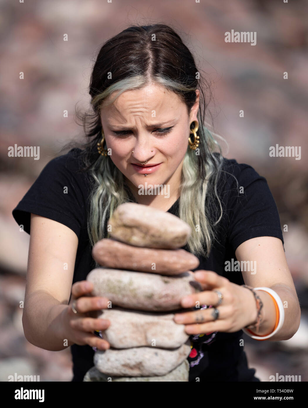 Dunbar, Scotland, UK. 20th Apr, 2019. Competitors in the 30 minutes most stones height event on Eye Cave beach in Dunbar during opening day of the European Stone Stacking Championship 2019. Credit: Iain Masterton/Alamy Live News Stock Photo
