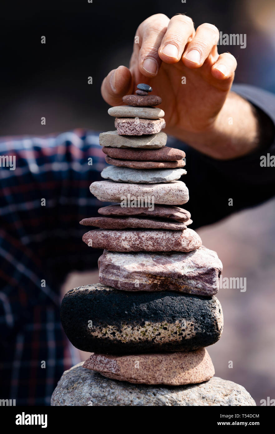 Dunbar, Scotland, UK. 20th Apr, 2019. Competitors in the 30 minutes most stones height event on Eye Cave beach in Dunbar during opening day of the European Stone Stacking Championship 2019. Credit: Iain Masterton/Alamy Live News Stock Photo