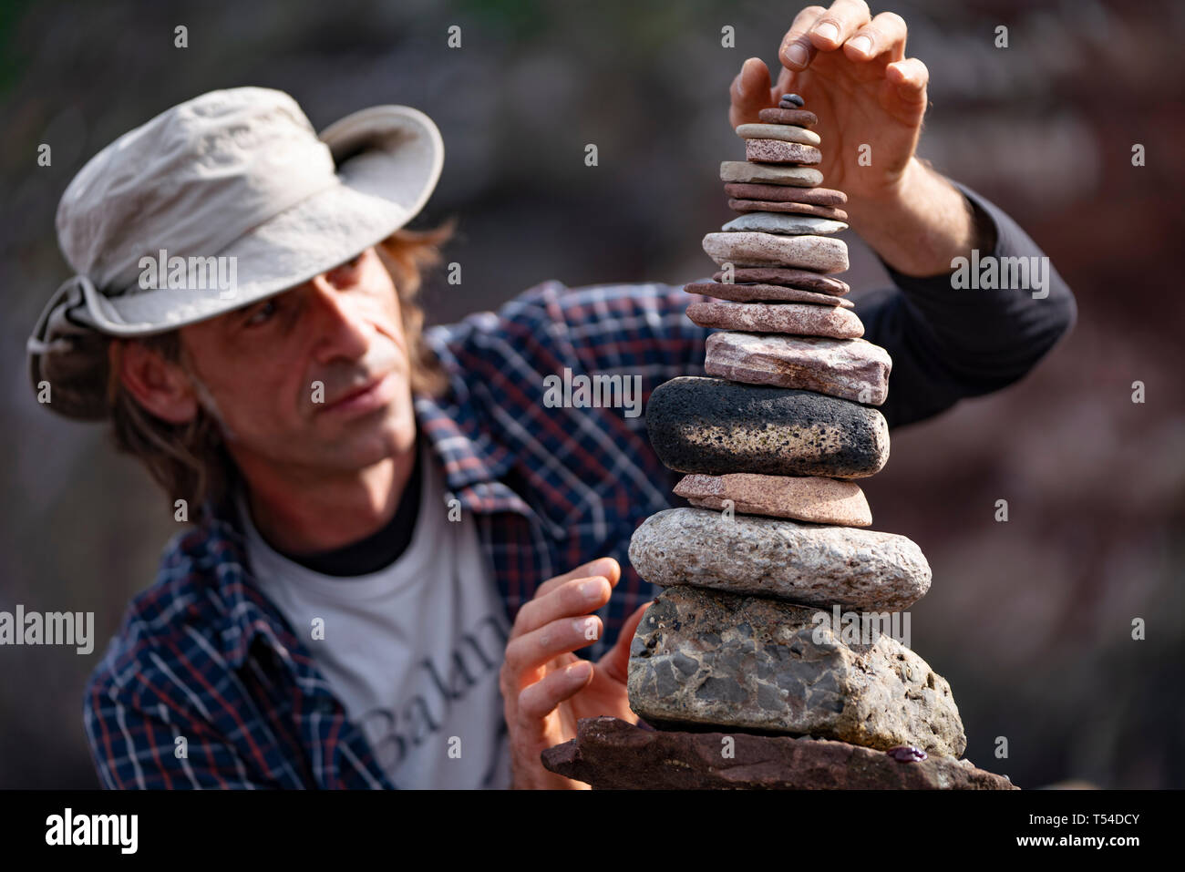 Dunbar, Scotland, UK. 20th Apr, 2019. Pedro Duran builds his stone stack during the 30 minutes height competition on Eye Cave beach in Dunbar during opening day of the European Stone Stacking Championship 2019. Credit: Iain Masterton/Alamy Live News Stock Photo