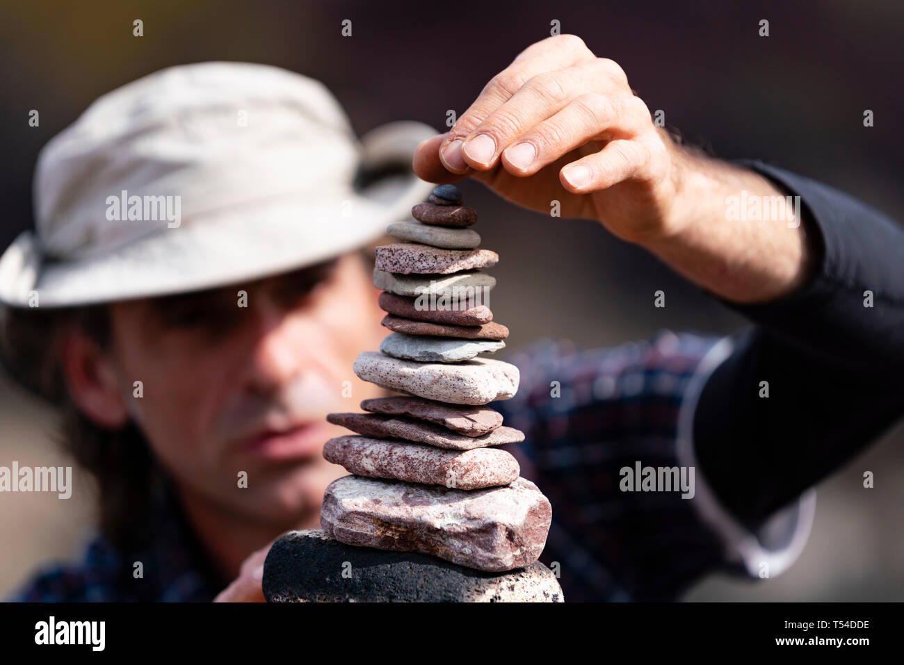Dunbar, Scotland, UK. 20th Apr, 2019. Pedro Duran builds his stone stack during the 30 minutes height competition on Eye Cave beach in Dunbar during opening day of the European Stone Stacking Championship 2019. Credit: Iain Masterton/Alamy Live News Stock Photo