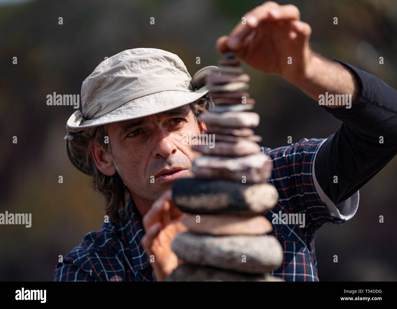 Dunbar, Scotland, UK. 20th Apr, 2019. Pedro Duran builds his stone stack during the 30 minutes height competition on Eye Cave beach in Dunbar during opening day of the European Stone Stacking Championship 2019. Credit: Iain Masterton/Alamy Live News Stock Photo
