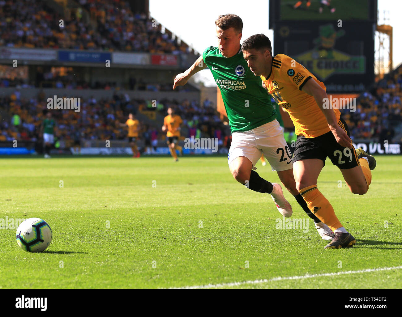 Wolverhampton, UK. 20th Apr, 2019. Ruben Vinagre of Wolverhampton Wanderers battles for the ball with Solly March of Brighton and Hove Albion Credit: Paul Roberts/OneUpTop/Alamy Live News Stock Photo