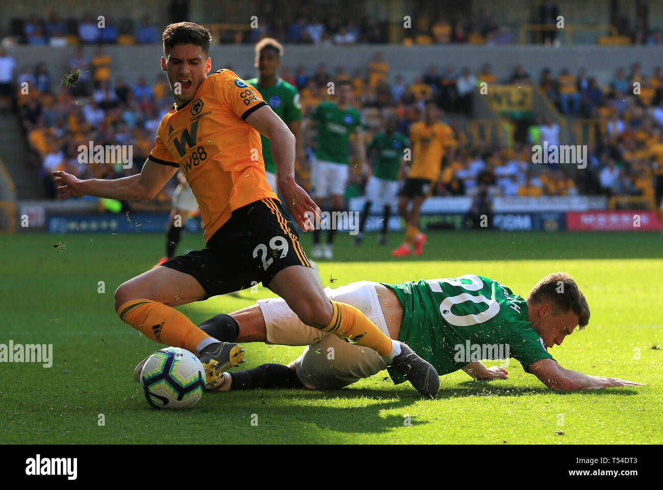 Wolverhampton, UK. 20th Apr, 2019. Ruben Vinagre of Wolverhampton Wanderers is fouled by Solly March of Brighton and Hove Albion Credit: Paul Roberts/OneUpTop/Alamy Live News Stock Photo