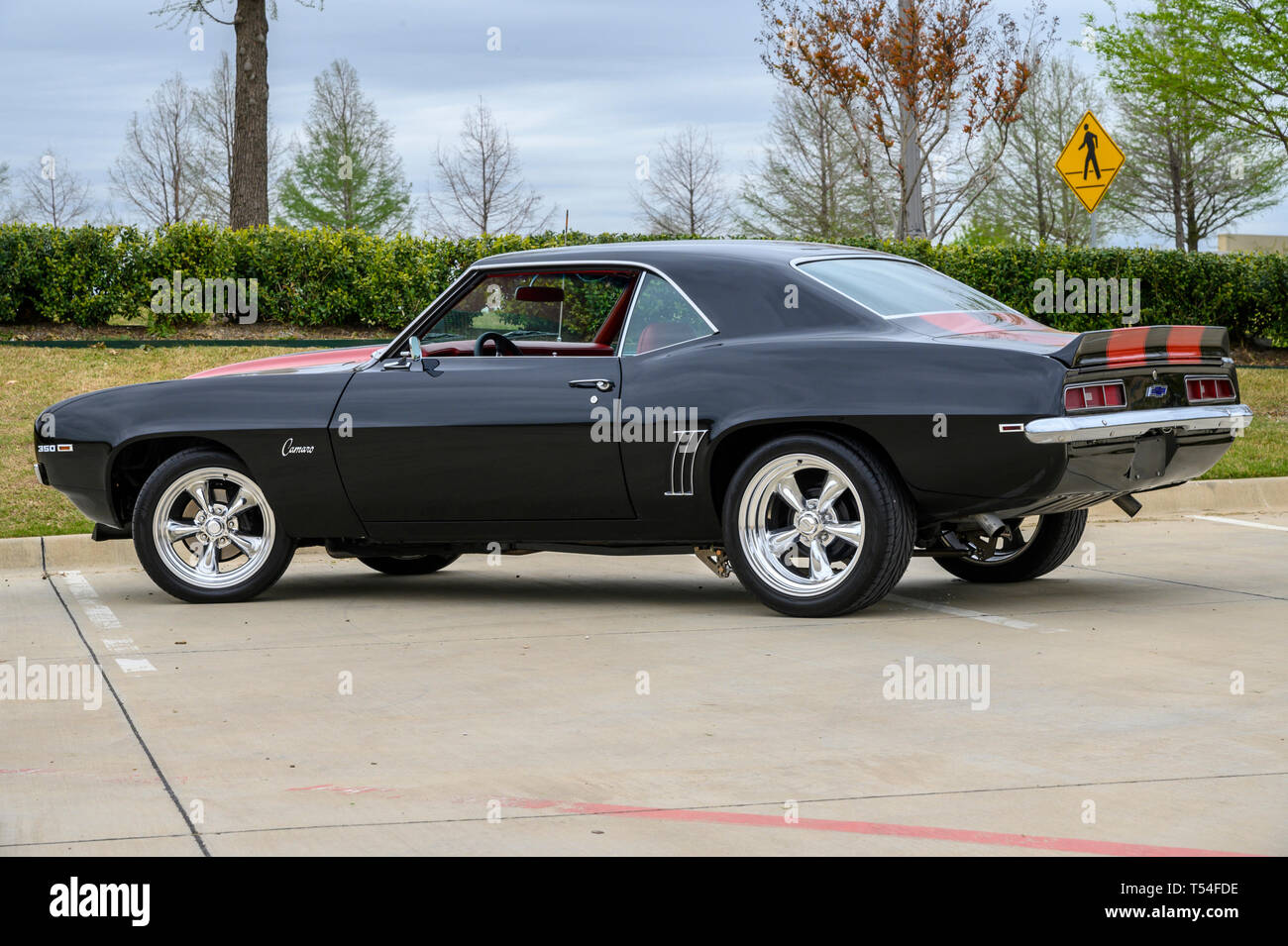 April 20, 2019: 1969 CAMARO SS RESTOMOD NEW 383 STROKER CRATE MOTOR LESS THAN ONE YEAR OLD NEW AFD ALUMINUM HEADS NEW HEADERS NEW FLOW MASTER MUFFLERS MSD DISTRIBUTER MSD IGNITION SERPENTINE BELT ELECTRIC FAN NEW QUICK FUEL CARB 750 DP COMPLETE NEW A/C AND HEAT POWER STEERING POWER BRAKES FRONT DISK AND REAR DRUM MUNCIE 220 4 SPEED TRANS NEW EATON POSI GEARS NEW NOS N20 WITH INSTALLED OUTLET PLATE BOTTLE AND LINE. NEVER USED ABSOLUTLY NO RUST OR BONDO REPAIRS COMPLETE DEEP PAINT IS LESS THAN 2 YEARS OLD NEW AMERICAN RACING WHEELS AND TIRES NEW RED SEATS CARPET DOOR PANELS NEW KENWOOD AMFMCD AU Stock Photo