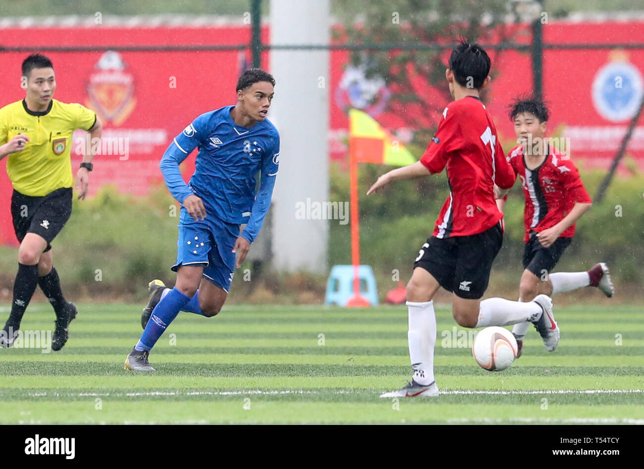 Haimen, China's Jiangsu Province. 21st Apr, 2019. Joao Mendes (2nd L) of Brazil Cruzeirio Esporte Clube competes during a match against South Korea Musan Middle School in Haimen, east China's Jiangsu Province, on April 21, 2019. The 14-year-old son of Ronaldinho, Joao Mendes, participates the 8th Zhongnan Codion Cup International Campus Football Invitation Tournament. Credit: Yang Lei/Xinhua/Alamy Live News Stock Photo