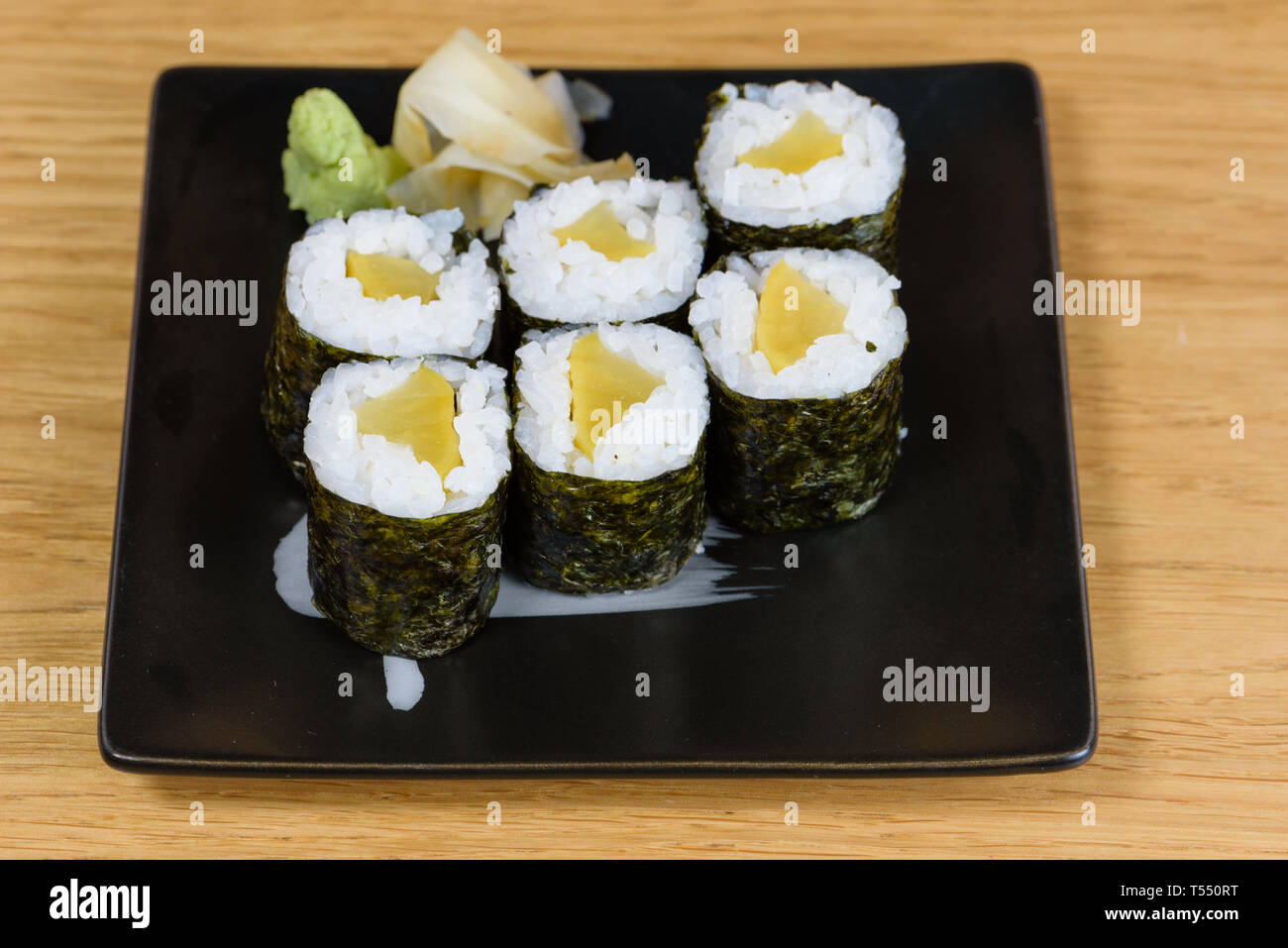 sinko maki, roll rice, nori seaweed and marinated turnip served with wasabi and gari Stock Photo
