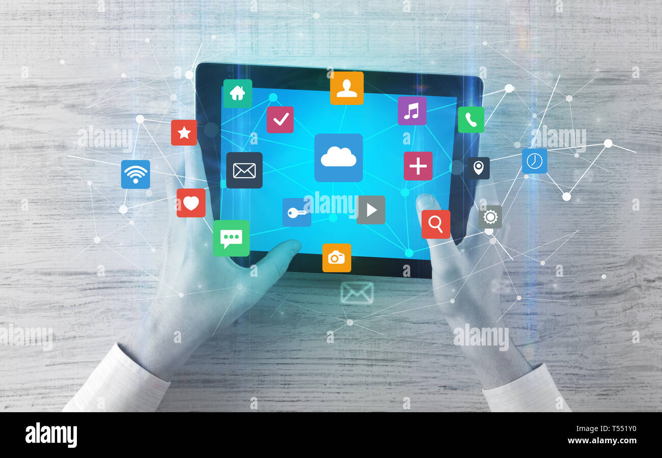 Hand touching multitask tablet with cloud wifi message social media ...