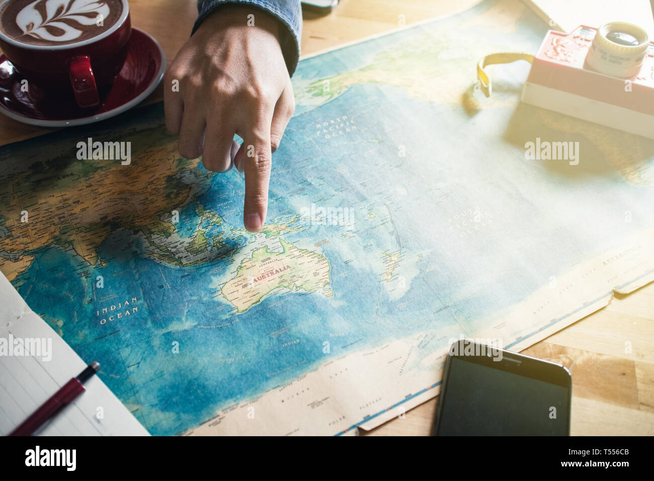 Tablet world map in hi res stock - Pointing At A Country In World Map Planning Vacation T556CB