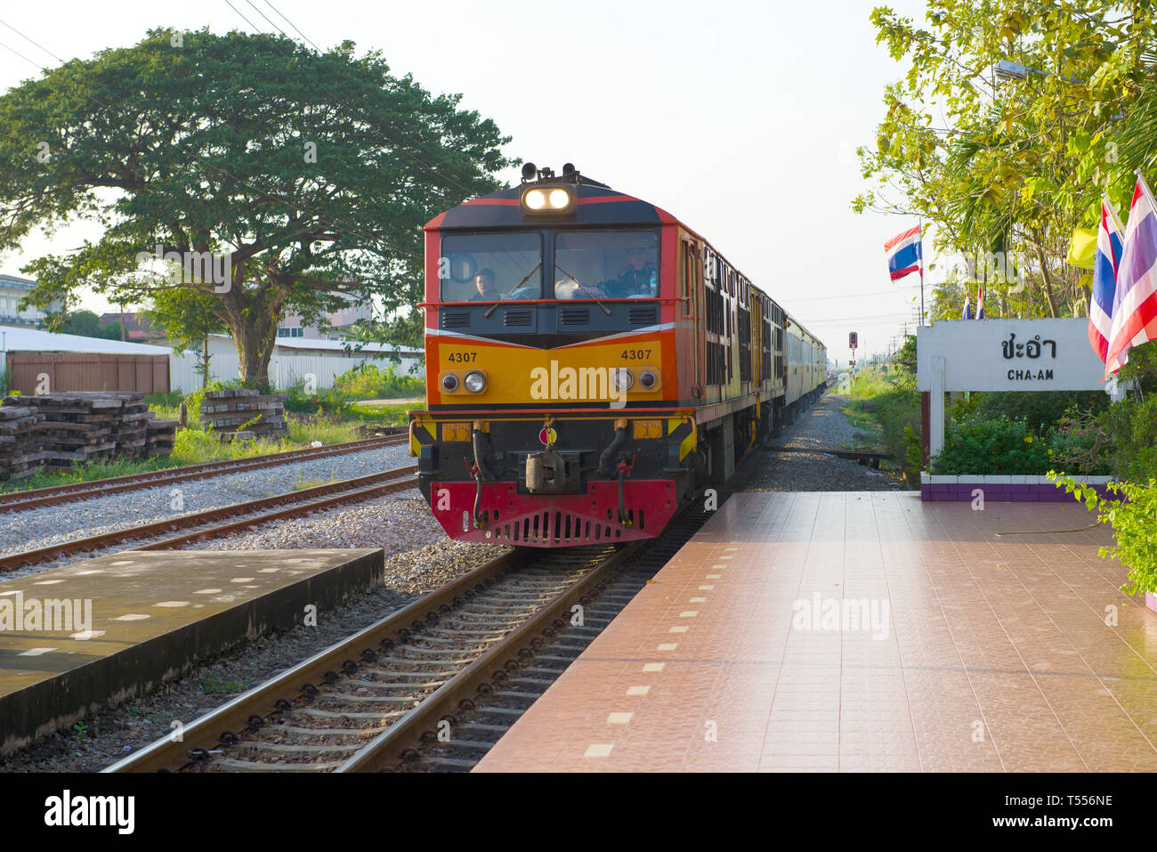 CHA-AM, THAILAND - DECEMBER 13, 2018: Passenger train arrives at the railway station Stock Photo