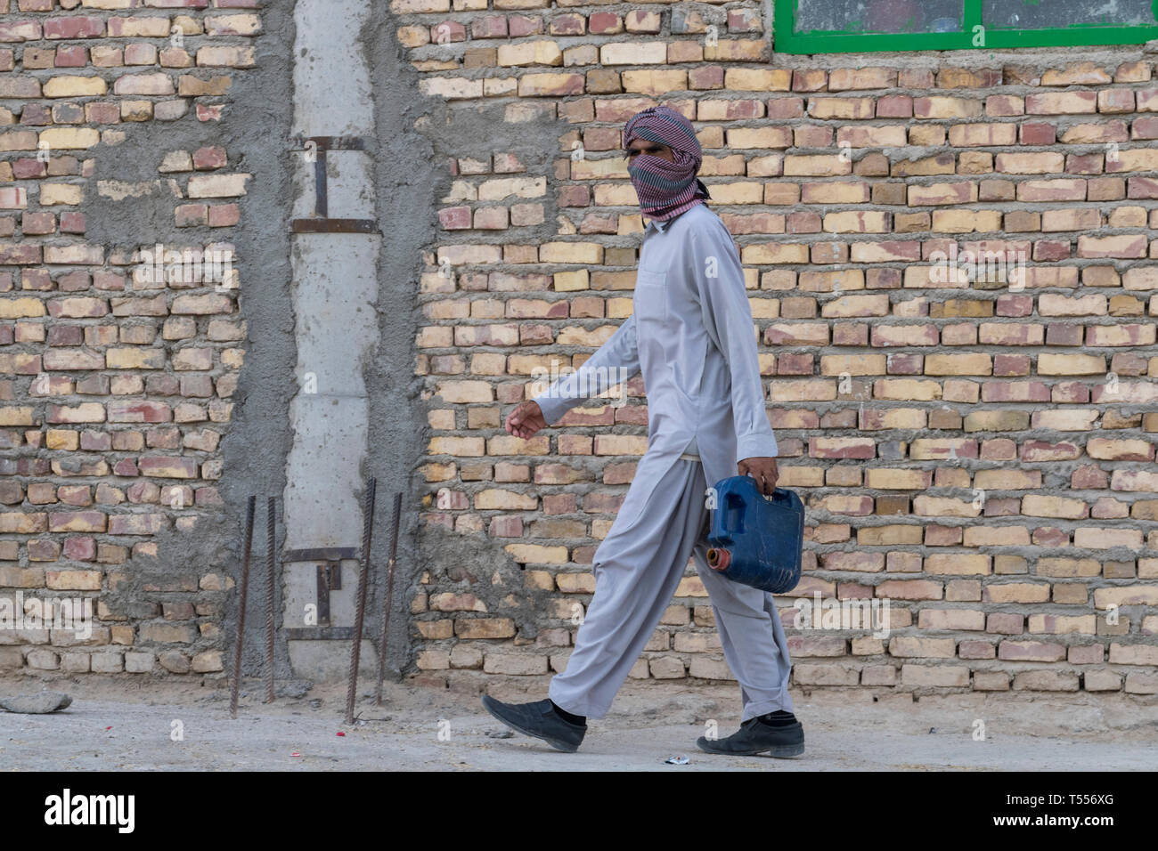Man Entering The Shrine of Bibi Doust, near Zabol, Sistan and Baluchistan, Iran Stock Photo