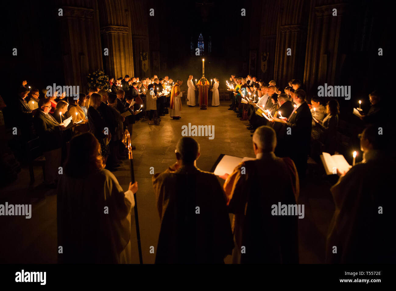 The candlelit Easter Vigil and Holy Eucharist at Lichfield Cathedral, a 5am service on Easter Sunday to mark the Christian belief in the resurrection of Christ as described in the New Testament of the Bible. Stock Photo