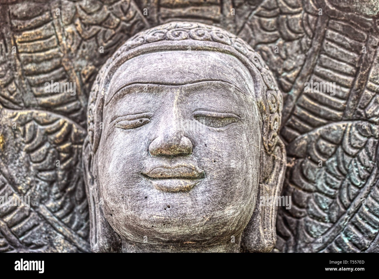 This unique photo shows the head of a beautiful Buddha statue made of stone. This photo was taken in Hua Hin in Thailand Stock Photo