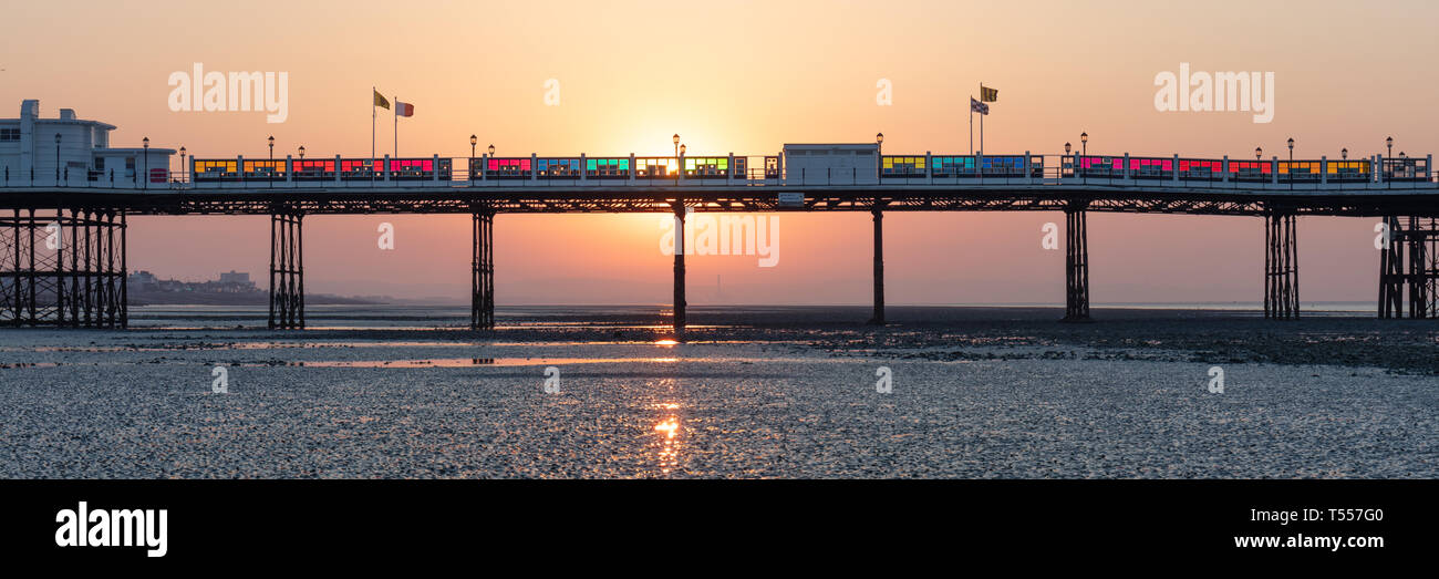 Worthing, Sussex, UK; 20th April 2019; Dawn With Sun Rising Behind Worthing Pier at Low Tide Stock Photo