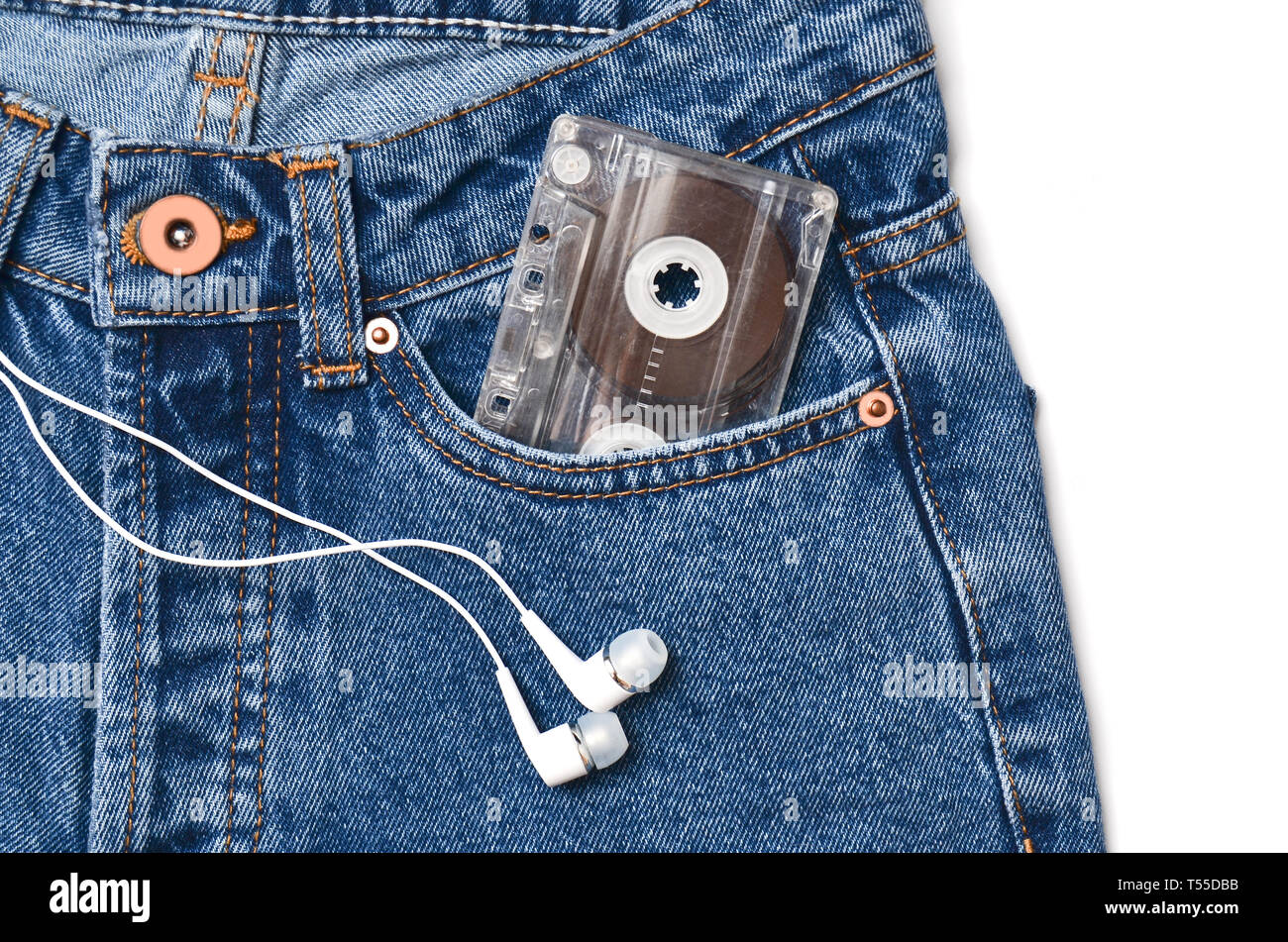 Audio cassette in a pocket of old-fashioned blue jeans and headphones  isolated on a white background Stock Photo - Alamy