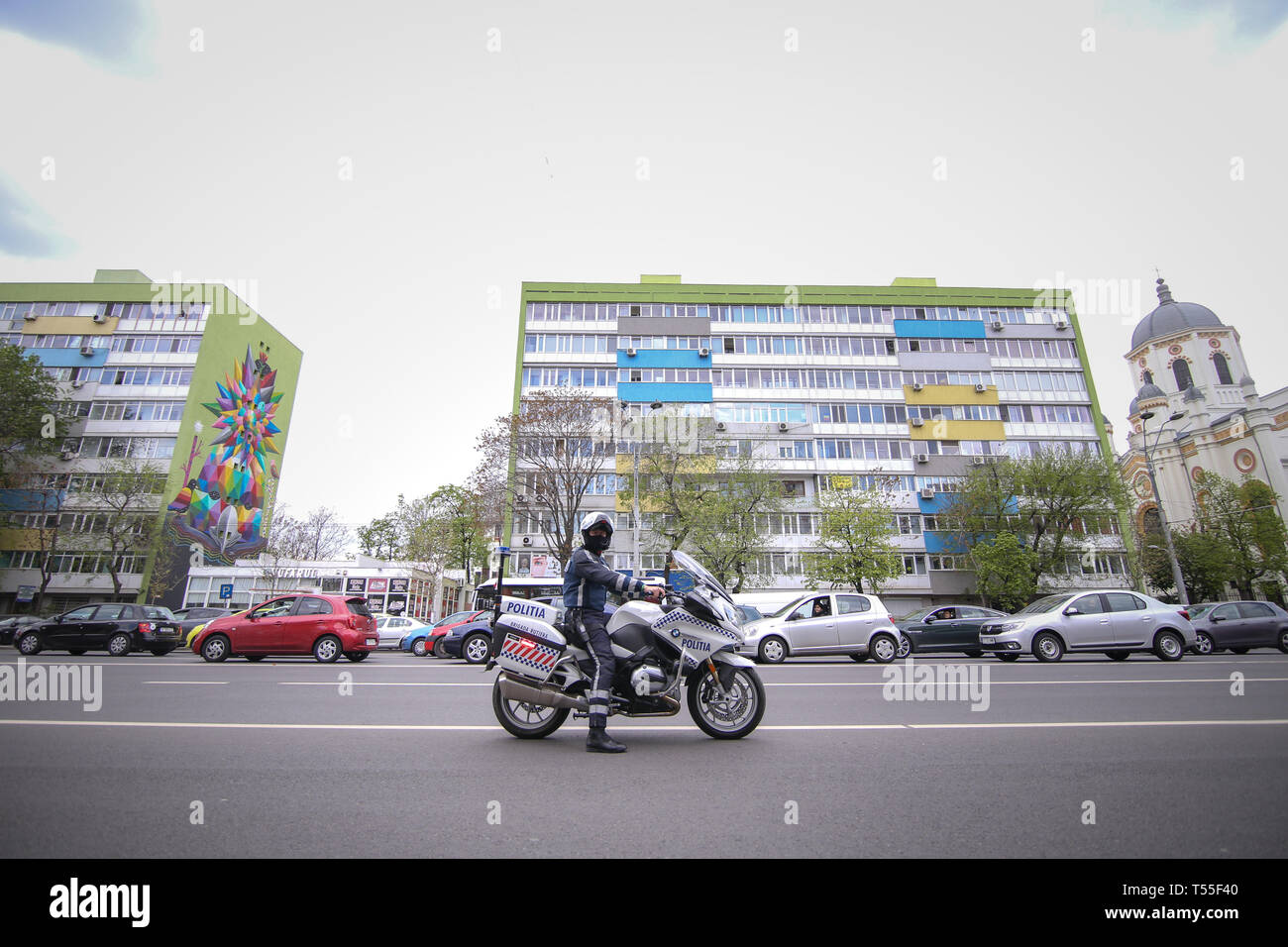 Bucharest, Romania - April 21, 2019: Police officer riding a BMW motorcycle in the Bucharest city traffic Stock Photo