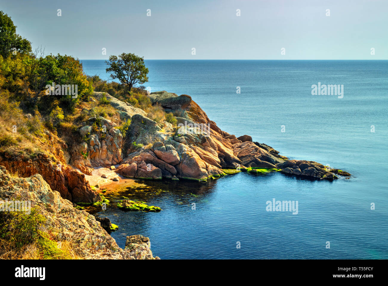 Beautiful landscape with rocky shore and blue sea Stock Photo - Alamy