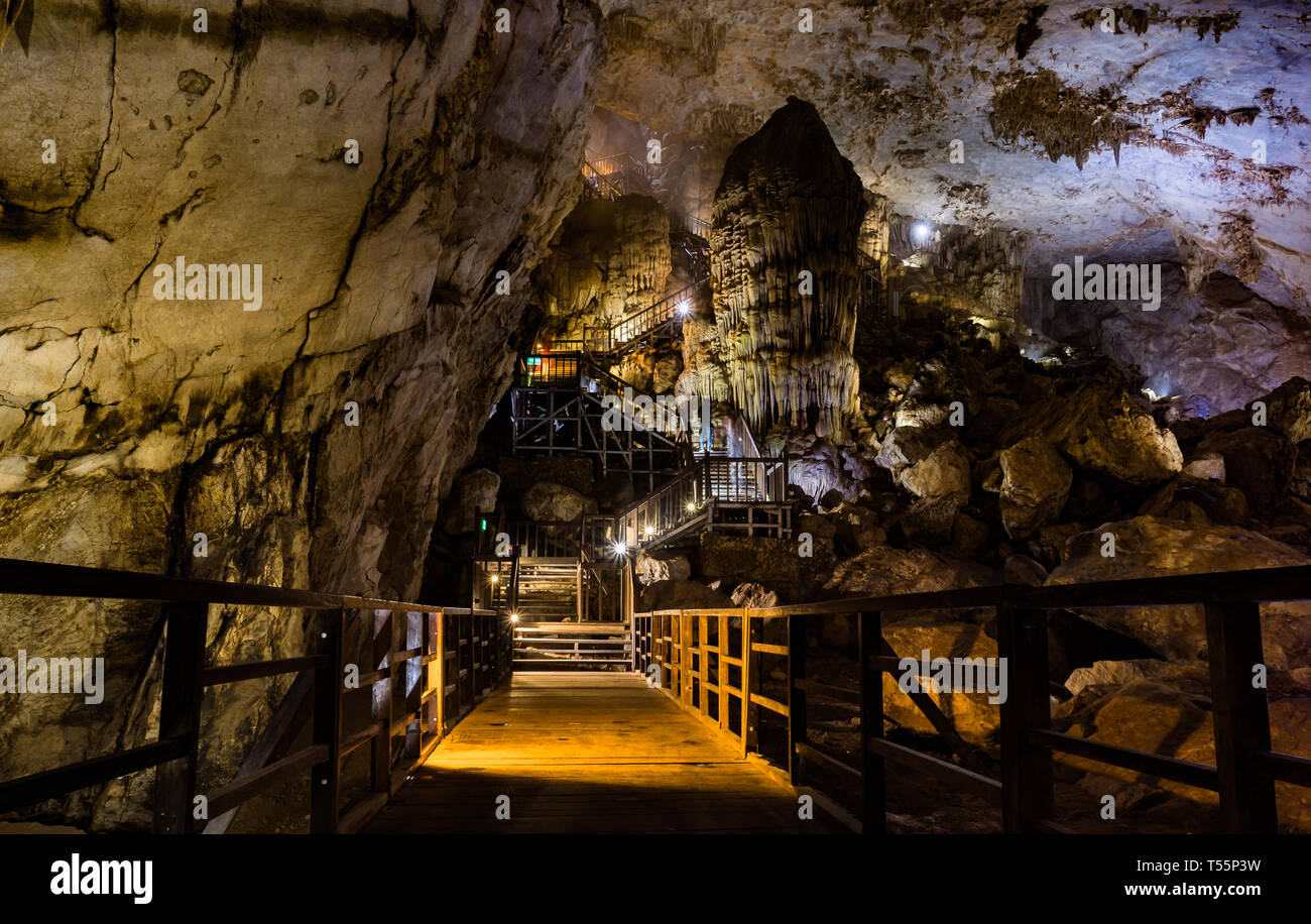 Walking trail through illuminated Paradise Cave, one of the biggest dry caves in the world, in Phong Nha Ke Bang national park, Vietnam, Asia Stock Photo