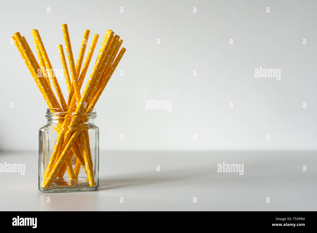 Yellow paper straws isolated on white background Stock Photo