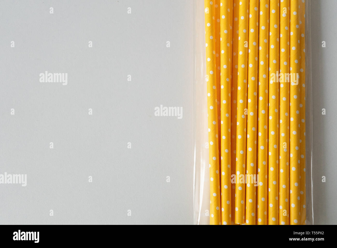 paper straws in plastic packaging isolated on white background Stock