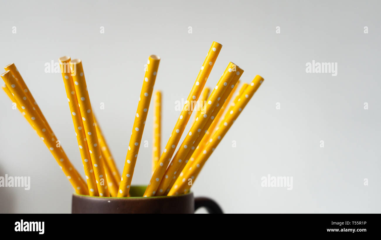 Yellow paper straws isolated on white background Stock Photo - Alamy