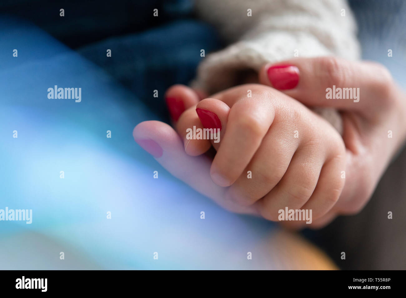 Mother and daughter holding hands Stock Photo
