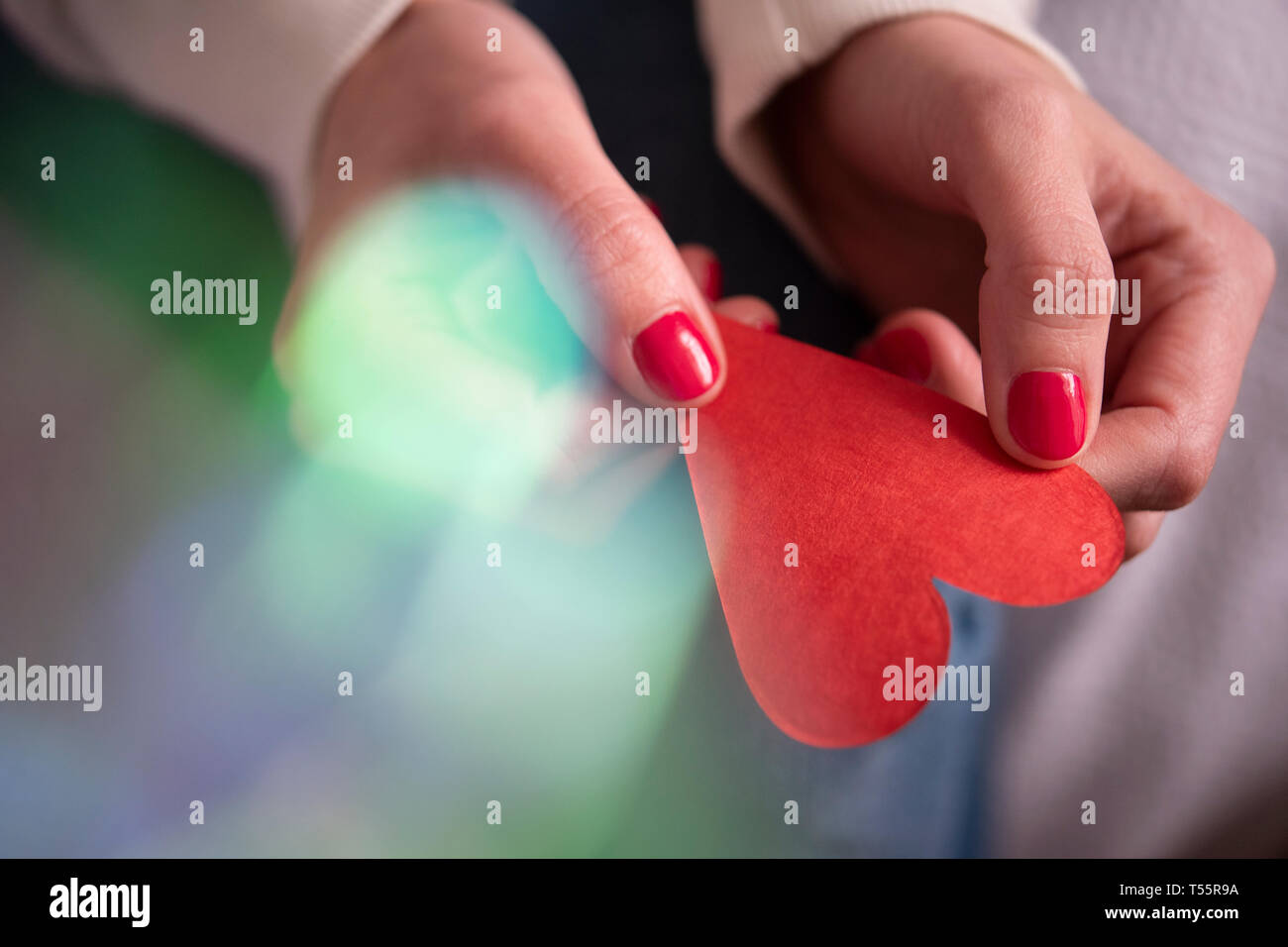 Hands holding paper red hi-res stock photography and images - Alamy