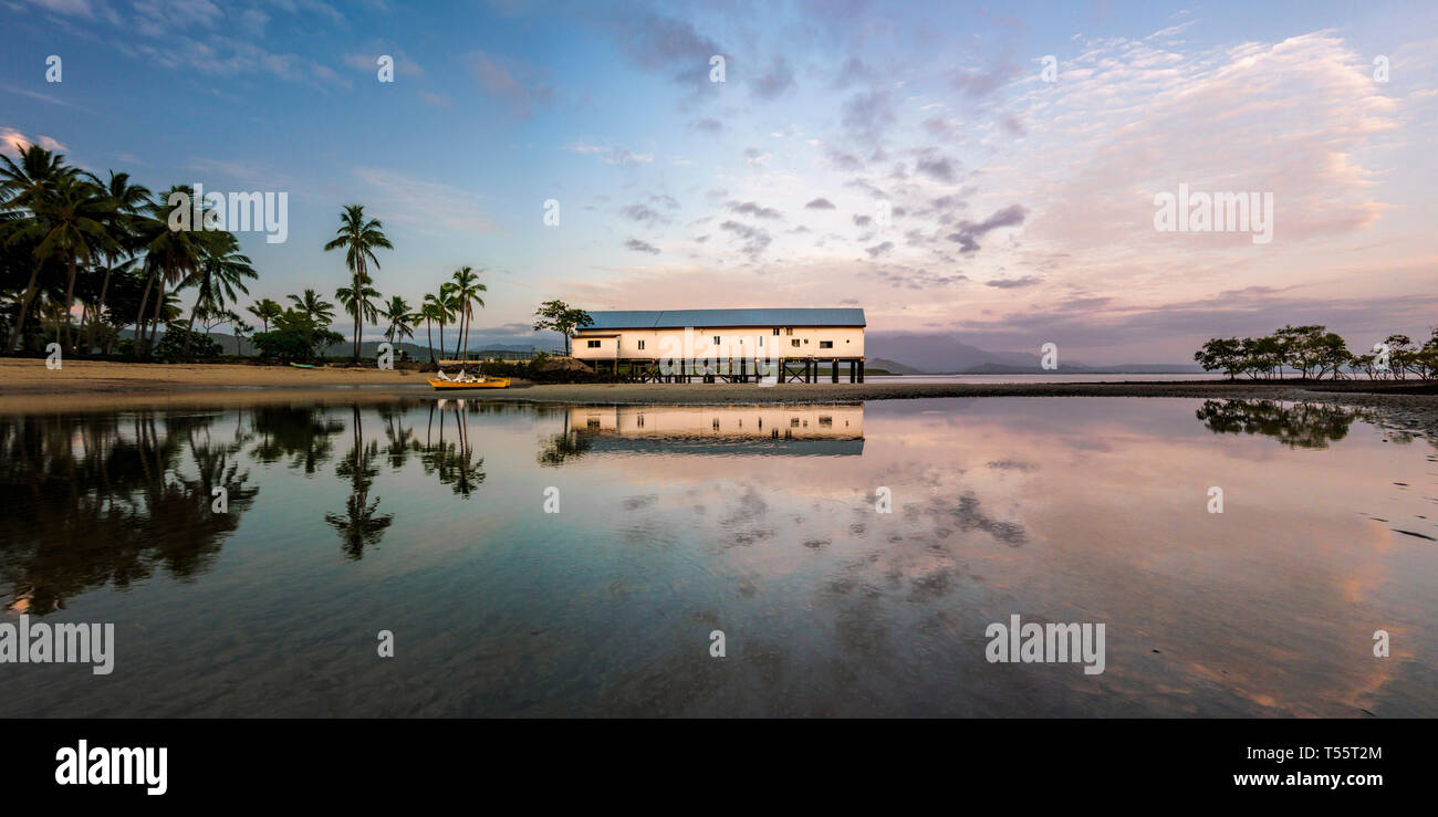 Building by beach at sunset in Port Douglas, Australia Stock Photo