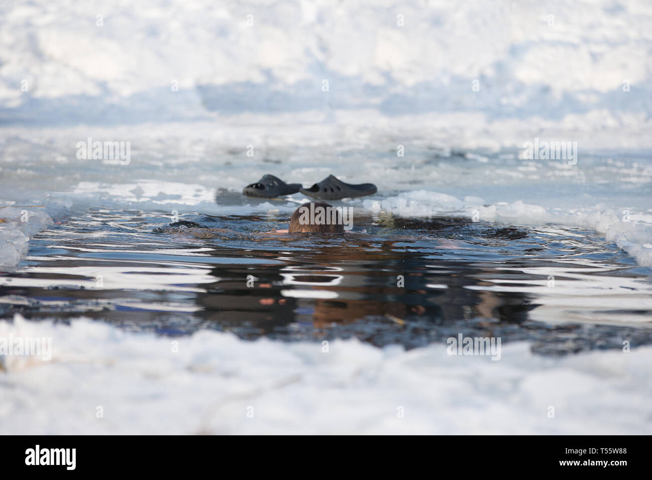 Bathing in an ice hole. Stock Photo