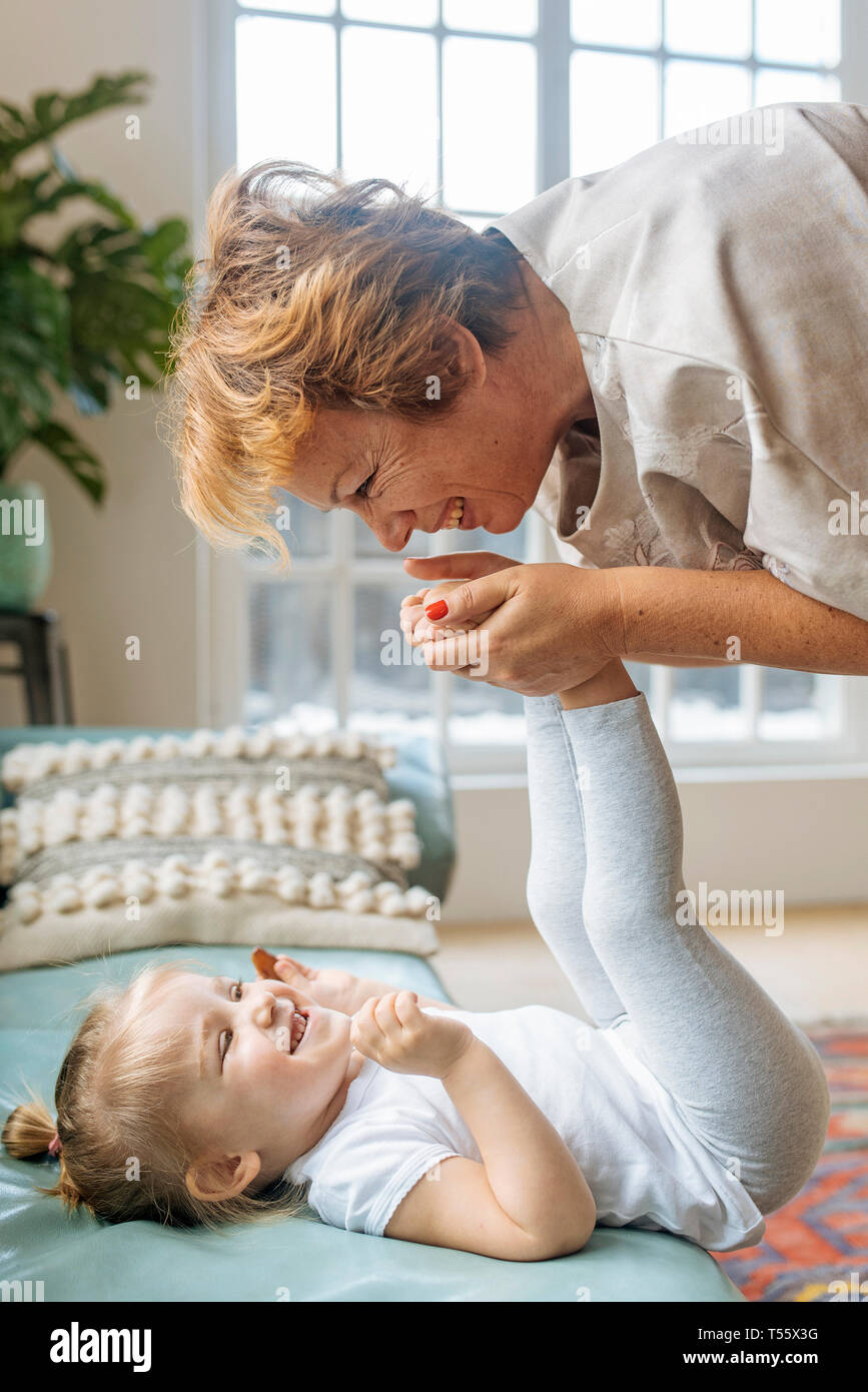 Grandmother playing with granddaughter Stock Photo