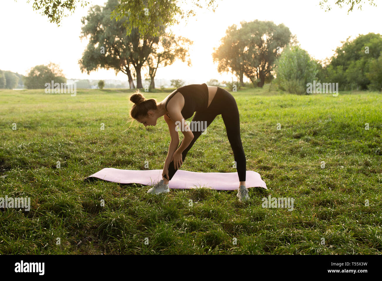 Woman bending over leggings hi-res stock photography and images - Alamy