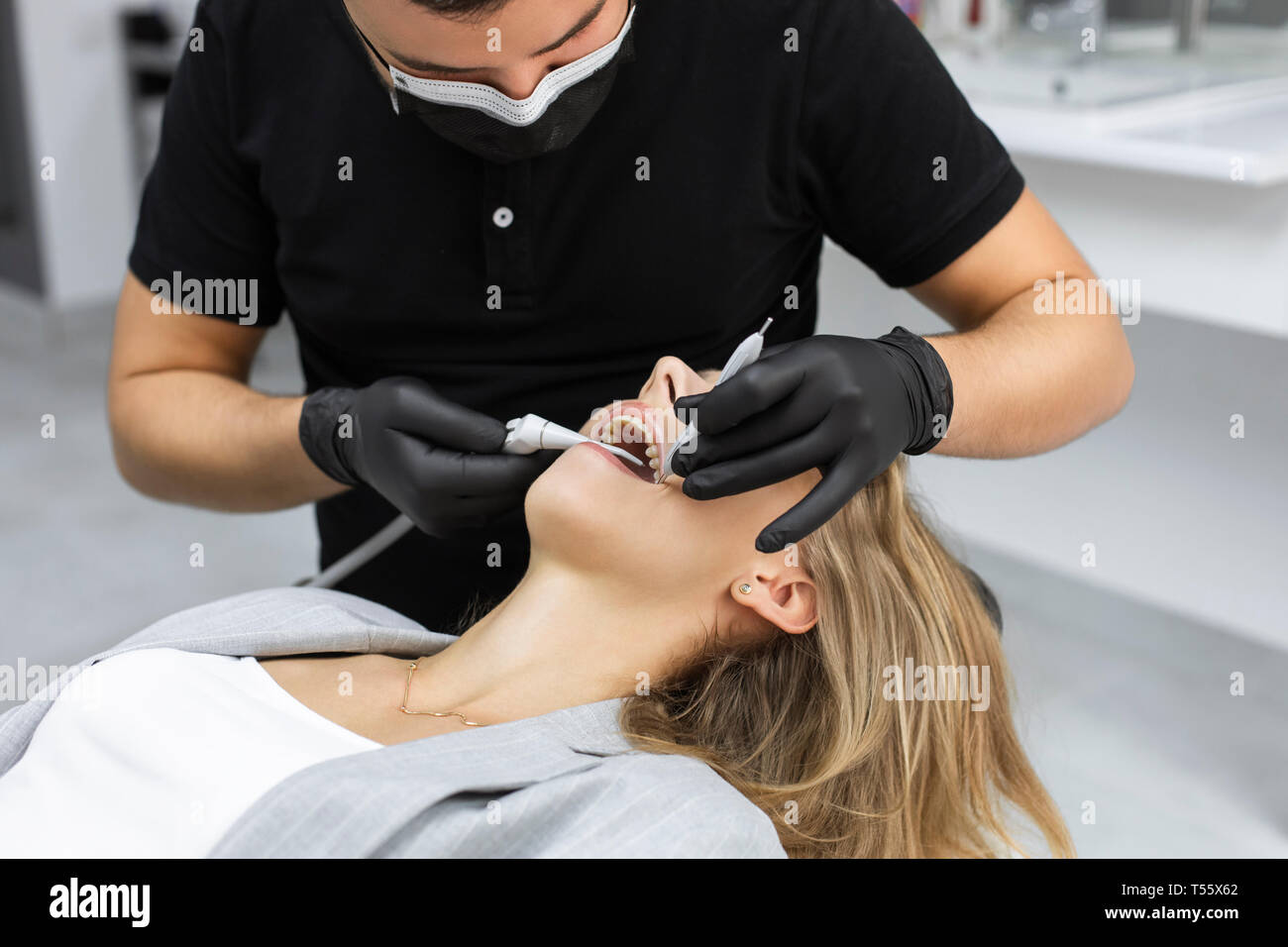 Dentist examining patient Stock Photo