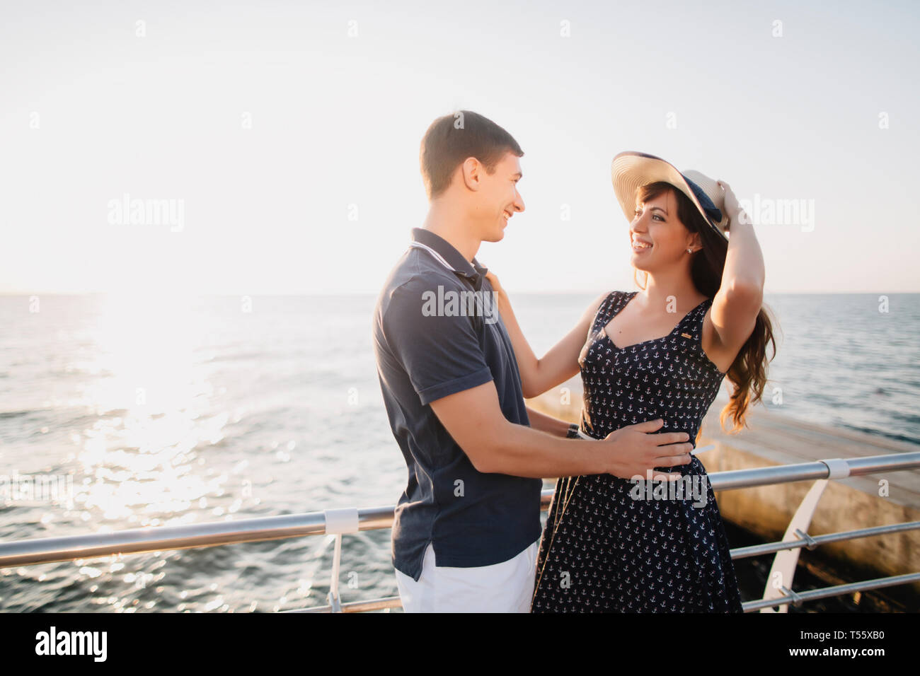 Young couple on pier Stock Photo