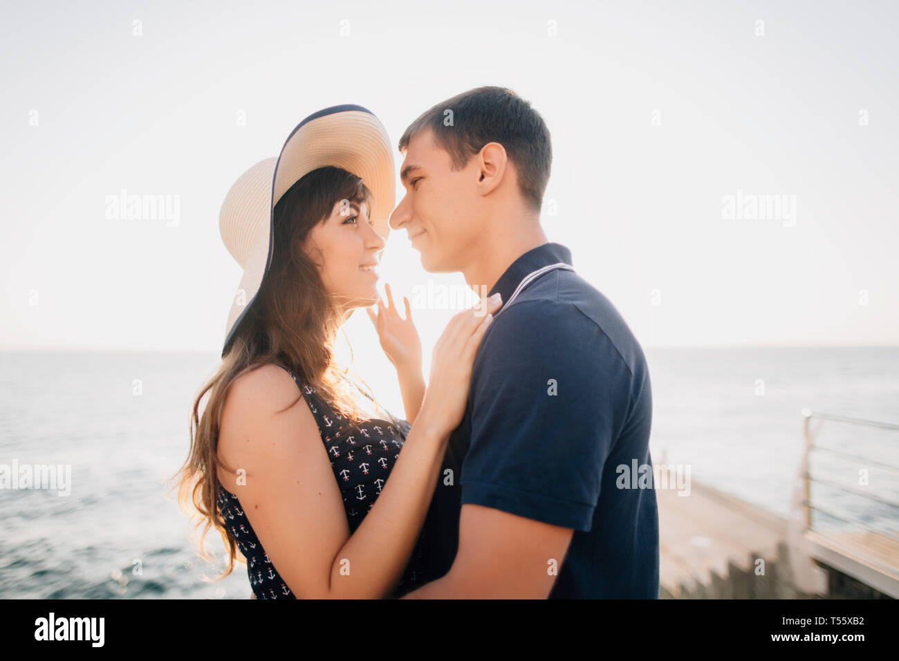 Young couple on pier Stock Photo