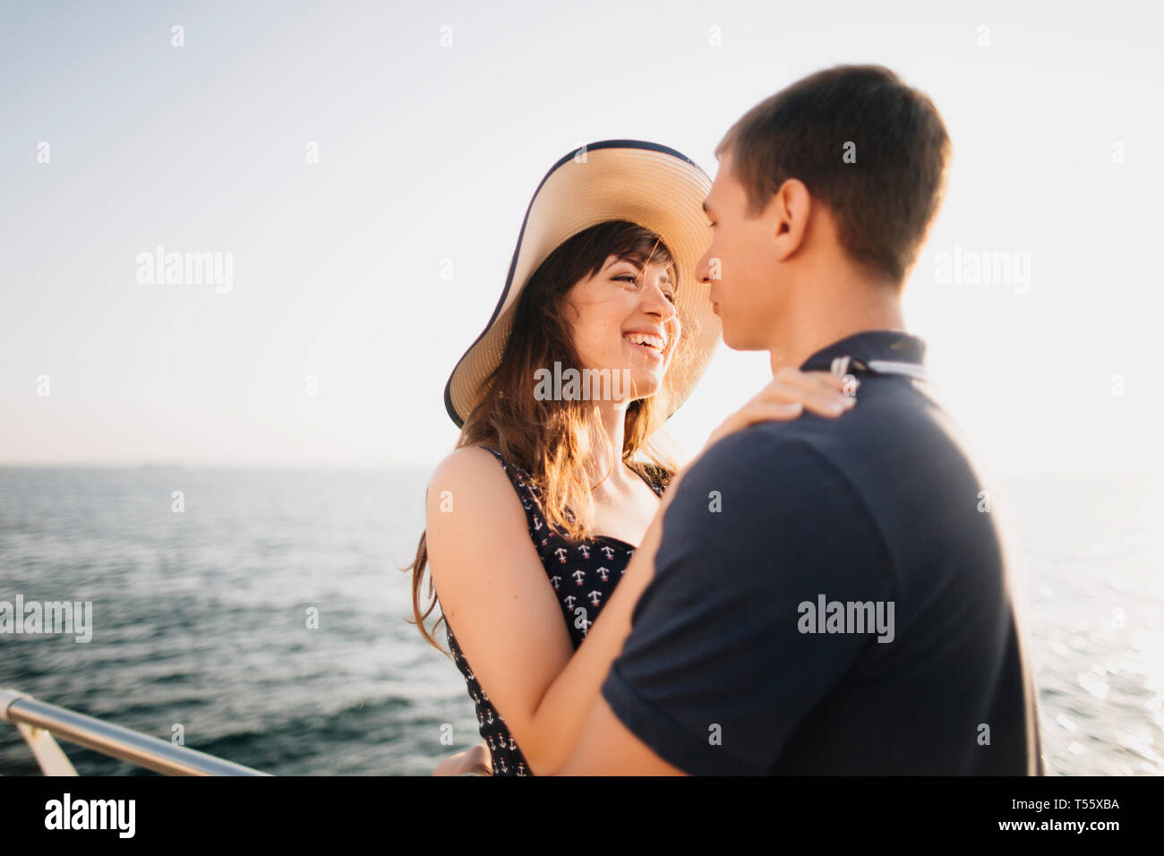 Young couple on pier Stock Photo