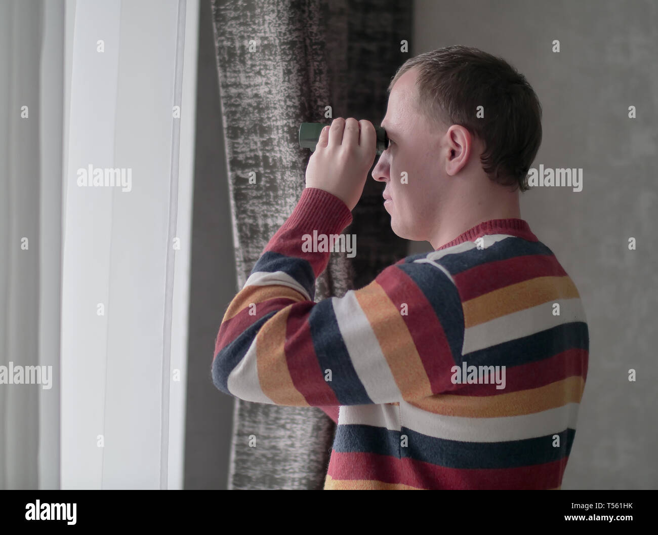 Spying out window hi-res stock photography and images - Alamy
