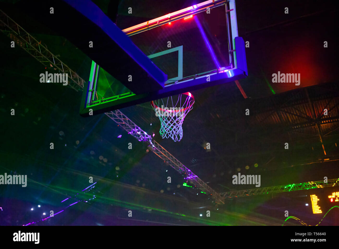 basketball hoop and sports arena in laser lights - game day Stock Photo -  Alamy