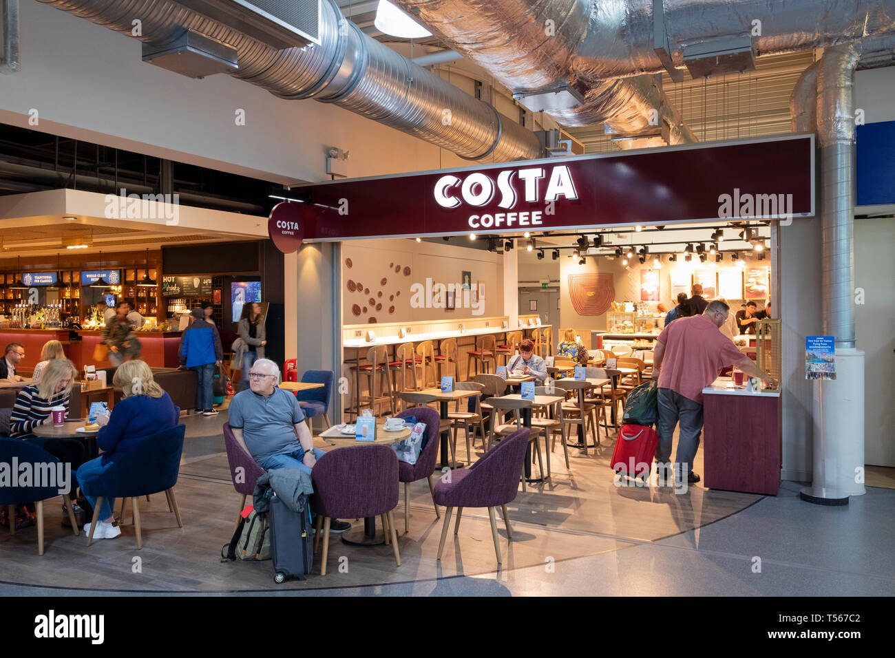 Bournemouth Airport departure hall interior passengers at Costa Coffee shop Stock Photo