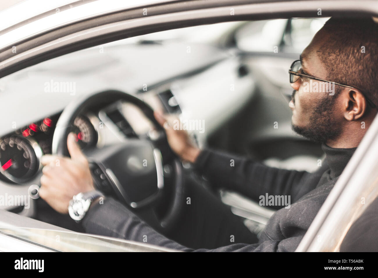 Businessman sits in black car hi-res stock photography and images - Alamy